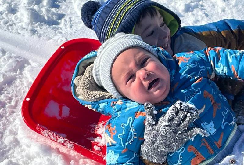 Snow and no school make for a busy sledding day in Ark City on Friday