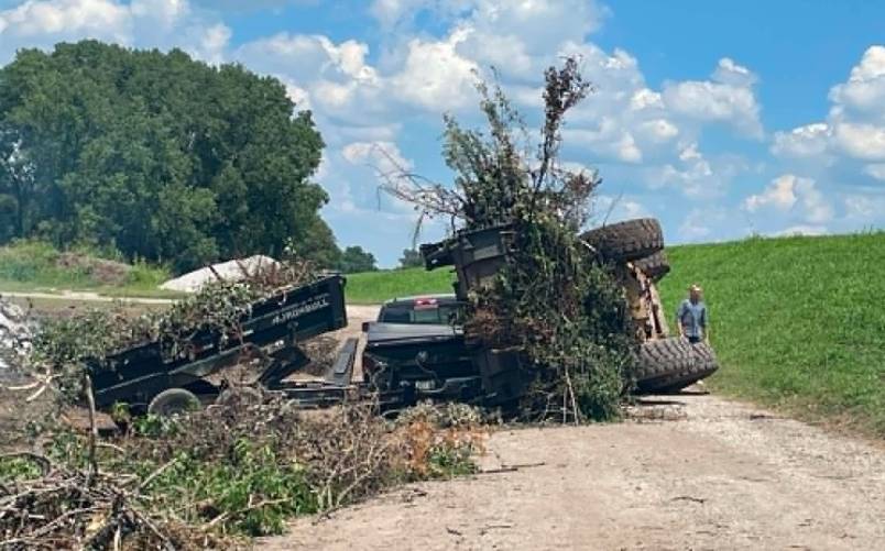 City loader overturns onto pickup truck Tuesday at Ark City compost center